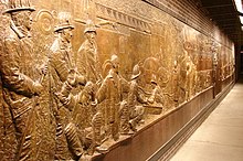 FDNY memorial bronze wall mural dedicated to the fallen firefighters, South of the WTC site NY-911-Memorial-0897.jpg