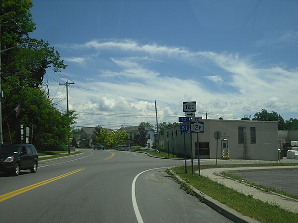 NY 12E at Bridge Street in Brownville. While signage indicates that NY 12E turns here, it officially continues straight onto CR 190.