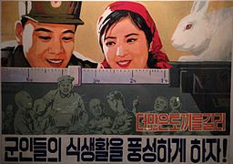 A North Korean propaganda poster stating, "Breed more rabbits and let our soldiers enjoy plentiful food!"