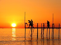 Fishermen under the sunset in Payallar, Alanya removed by Alvesgaspar[3]