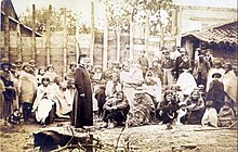 A Brazilian priest with Paraguayan refugees coming from San Pedro, 1869 or 1870 Paraguayan refugees from the town of San Pedro.jpg