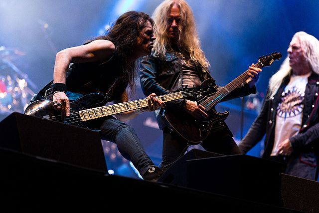 Bassist Tim "Nibbs" Carter and guitarist Doug Scarratt at the Rockharz 2016 (Biff Byford in the background)