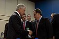 Secretary of Defense Chuck Hagel greets Greek Minister of Defense Panos Panagiotopoulos.jpg