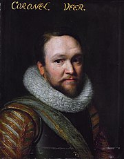 Head and shoulders portrait of a man in 17th century military attire. He wears a breastplate and a thick, fur collar. He has a short, brown beard and mustache and a very slight smile.