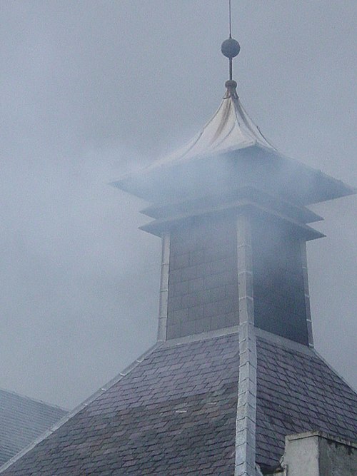 The distinctive "pagoda" chimney of a kiln at a distillery in Scotland.