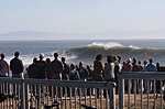 A crowd watches the waves at Steamer Lane