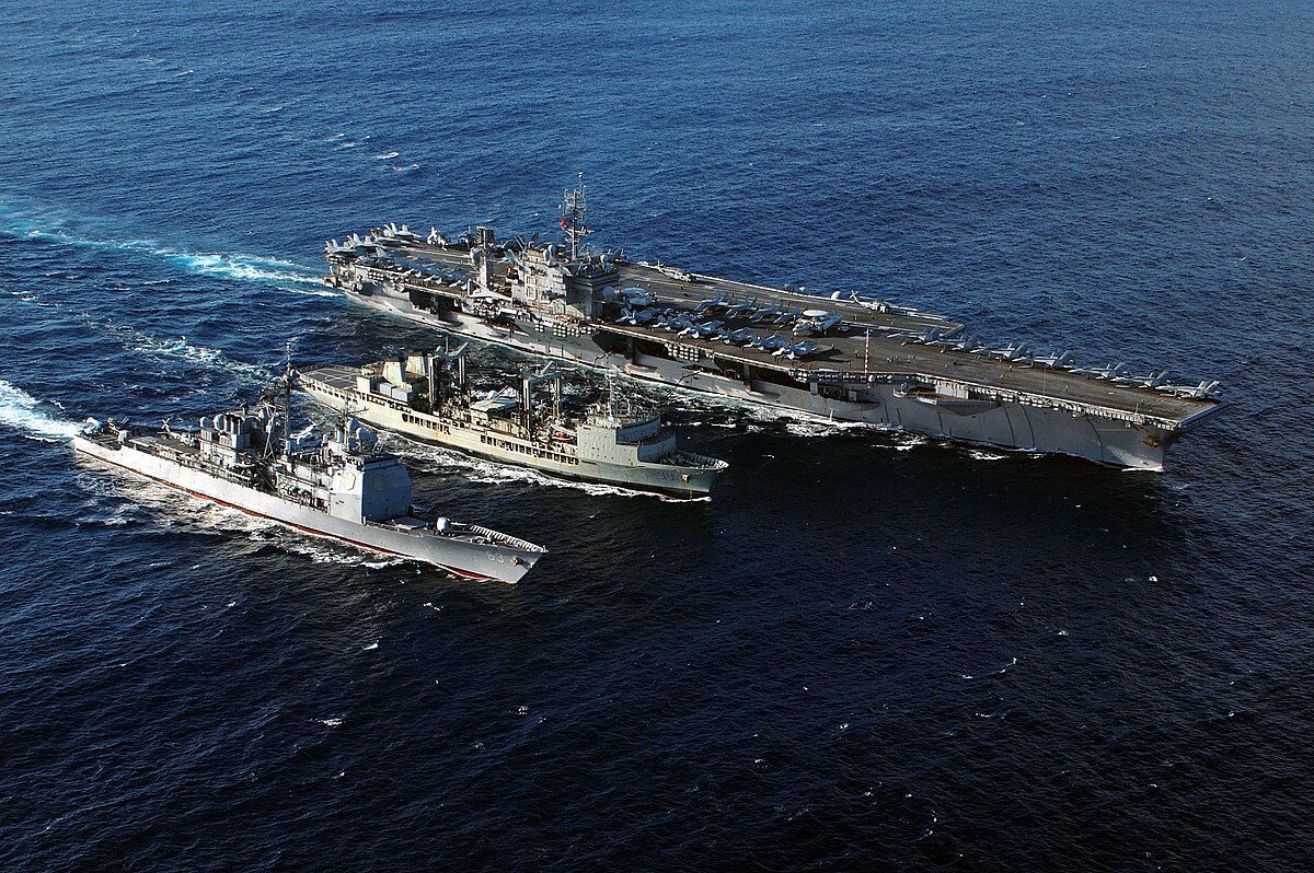 US Navy 050614-N-0120R-050 The conventionally powered aircraft carrier USS Kitty Hawk (CV 63) and the guided missile cruiser USS Cowpens (CG 63) receives fuel during a replenishment at sea.jpg