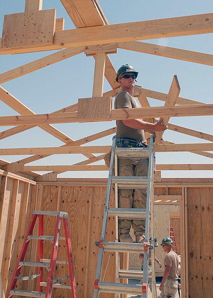 File:US Navy 070909-N-3560G-074 Builder 3rd Class Mason Lynn, assigned to Naval Mobile Construction Battalion (NMCB) 4, constructs the roof on a berthing facility.jpg