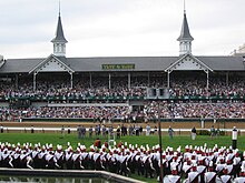 Kentucky's Churchill Downs hosts the Kentucky Derby. University of Louisville marching band, Churchill Downs Twin Spires.jpg