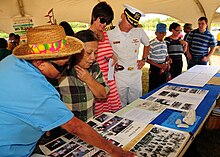 The commanding officer of Naval Base Guam and former residents of Sumay at the old location of the village on Back to Sumay Day, 2013 130413-N-BK345-081 (8654218912).jpg