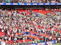 Hull Kingston Rovers players and staff start the long walk up to Wembley's Royal Balcony to collect their runner-up awards.