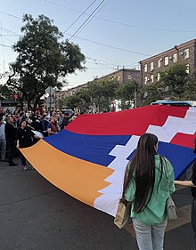 Protesters in front of the Russian embassy in Yerevan carried the Artsakh flag. 2023 Russian embassy protest in Yerevan.jpg