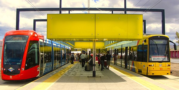 Two low floor trams, an Alstom Citadis 302 and Bombardier Flexity Classic, in Adelaide, South Australia