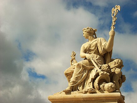 A sculpture at the entrance to the palace of Versailles