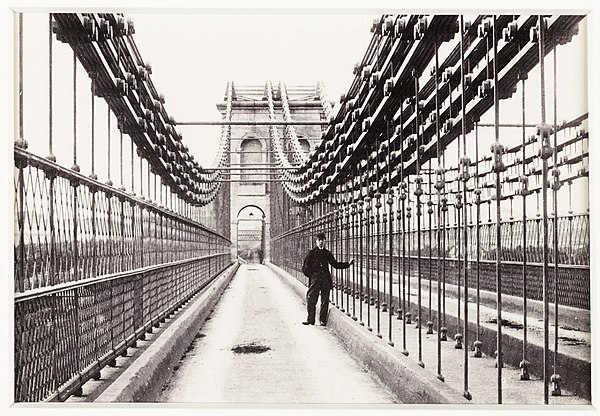 The bridge c. 1880, showing the original cable configuration prior to the installation of steel cables in 1938