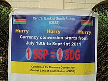 Banner in Juba announcing the conversion from the Sudanese pound (SDG) to the new currency the South Sudanese pound (SSP) Banner in Juba mid July 2011 announcing the conversion from the Sudanese Pound (SDG) to the new currency the South Sudanese Pound (SSP).jpg