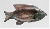 Cosmetic dish in the shape of a tilapia fish; 1479–1425 BC; glazed steatite; 8.6 × 18.1 cm (3.4 × 7.1 in); Metropolitan Museum of Art
