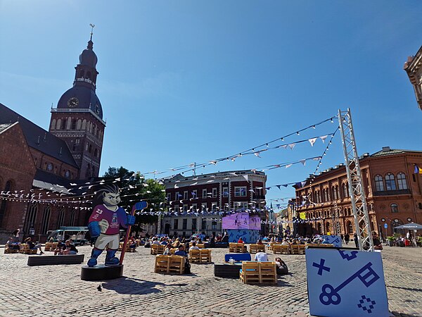 Watching hockey in Dome Square, Riga