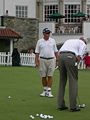 Jim Furyk's caddie Fluff Cowan watches Furyk on the putting green of the Congressional Country Club's Blue Course during the Earl Woods Memorial Pro-Am prior to the 2007 AT&T National tournament. Cowan is a member at Congressional.