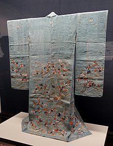 A light blue kimono displayed on an exhibition stand