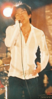 Japanese singer and composer Kazufumi Miyazawa composed the music for "Dunia Milik Kita". Kazufumi Miyazawa (2005).png