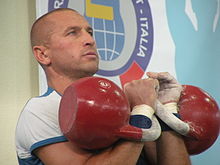 Performing jerk with 32 kg kettlebells (rack position) Kettlebell.JPG