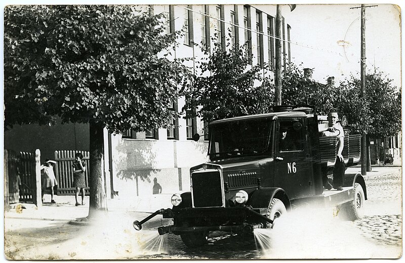 File:Lithuanian cityscape. The street the city is washed with water by a dual-purpose vehicle of the Panevėžys municipality fire department, 1940, Panevėžys, Lithuania.jpg