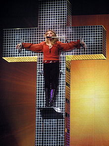 The performance of "Live to Tell" on the Confessions Tour (2006), where Madonna sang hanging from a cross, was negatively received by both religious groups and music critics. LiveToTellFresno2.jpg