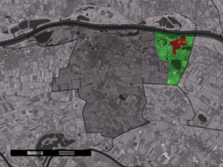 The town centre (red) and the statistical district (light green) of Deest in the municipality of Druten.