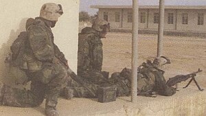 Marines from 3/7 establish firing position inside an Iraqi army camp near An Numaniyah. Marines from 3rd Battalion 7th Marines establish firing position inside an Iraqi army camp near An Numaniyah.jpg