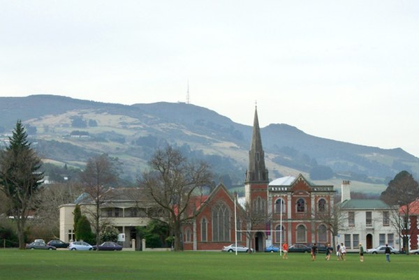 Mount Cargill (centre) and Buttar's Peak (to the right of the church steeple) dominate the skyline of Dunedin, New Zealand