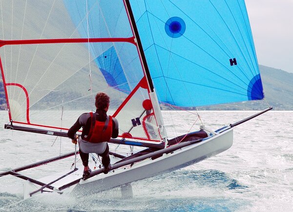 A Musto Performance Skiff dinghy on the reach