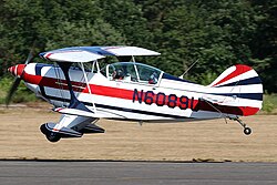 An airplane landing at Zwartberg Airfield.