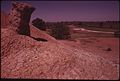 ODDLY SHAPED OUTCROPPINGS OFTEN APPEAR ON THE MOUNDS OF RED CLAY AND SHALE THAT MARK THE SITES OF ABANDONED DEEP... - NARA - 552445.jpg