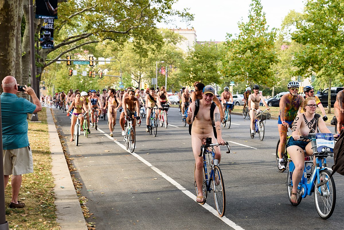 Naked women riding bicycle