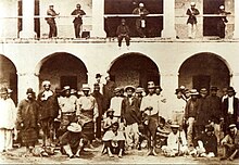 Paraguayan prisoners during the allied occupation of Asuncion in 1869. Paraguayan POW and Brazilian soldiers.jpg