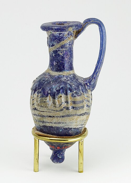 Ancient Egyptian perfume vase in shape of an amphoriskos; 664–630 BC; glass: 8 × 4 cm (3.1 × 1.5 in); Metropolitan Museum of Art (New York City)