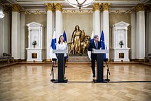 Prime Minister Sanna Marin and President Sauli Niinisto at the press conference announcing Finland's intent to apply to NATO on 15 May 2022. Presidentti Sauli Niinisto ja paaministeri Sanna Marinin tiedotustilaisuus 15.5.2022 (52075250080).jpg