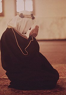 Faisal praying in a mosque