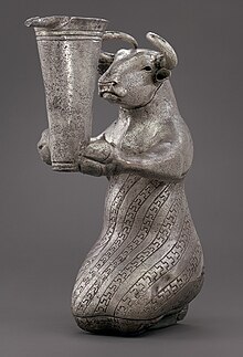 Proto-Elamite kneeling bull holding a spouted vessel.jpg