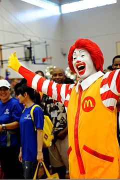 Ronald McDonald cheers during the Special Olympics opening ceremony at Kadena Air Base in Okinawa, Japan, Nov 111105-F-ZT401-232.jpg