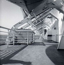 The first-class open promenade, one of several promenades and class-exclusive locations onboard SSUnitedStates1964SunDeck.jpg