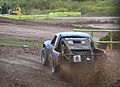 Off Road Driver Scott Taylor racing in heavy rain at a TORC off-road race at w:Crandon International Off-Road Raceway.   This file was uploaded with Commonist.