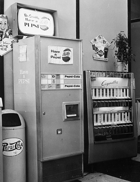 File:Soft drink and cigarette machines at Clark's, a grocery, drug, sundries, and department store and lunch counter, 3900 North Independence Boulevard, Charlotte, NC, c.1962 or 1963. From the General (6876069449).jpg