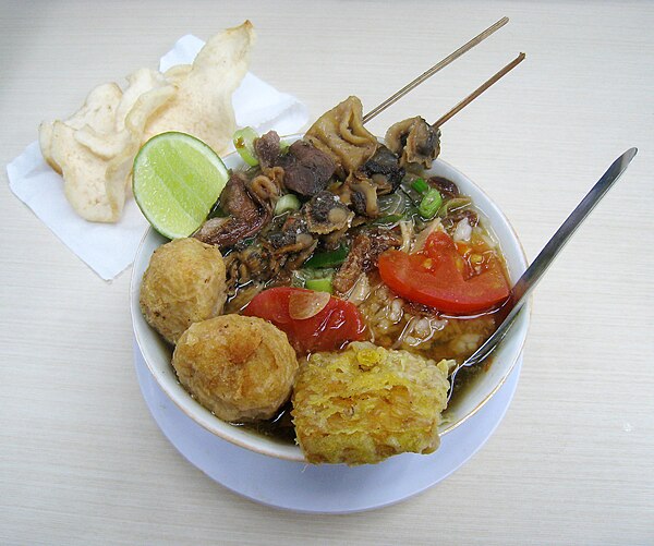 Soto Semarang from Semarang, chicken soto with cockles and tripes satay, fried tempeh, and perkedel