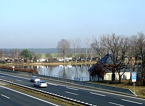 In the back the reservoir, in front the motorway over the dam