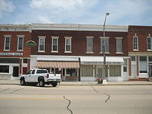 The structures at 113 and 115 Main were built simultaneously. 115 Main has been a funeral home since 1903. Tampico Il Main St Hist Dist 113-115 Main1.jpg