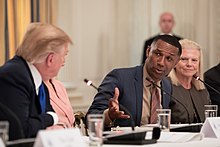 Taylor discussing workforce development with President Donald Trump in March 2019 The American Workforce Policy Advisory Board Meeting (40344752773).jpg