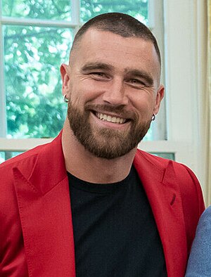 Kelce smiling at a camera