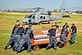 USN loads water onto SH-60F in Port-au-Prince 2010-01-18